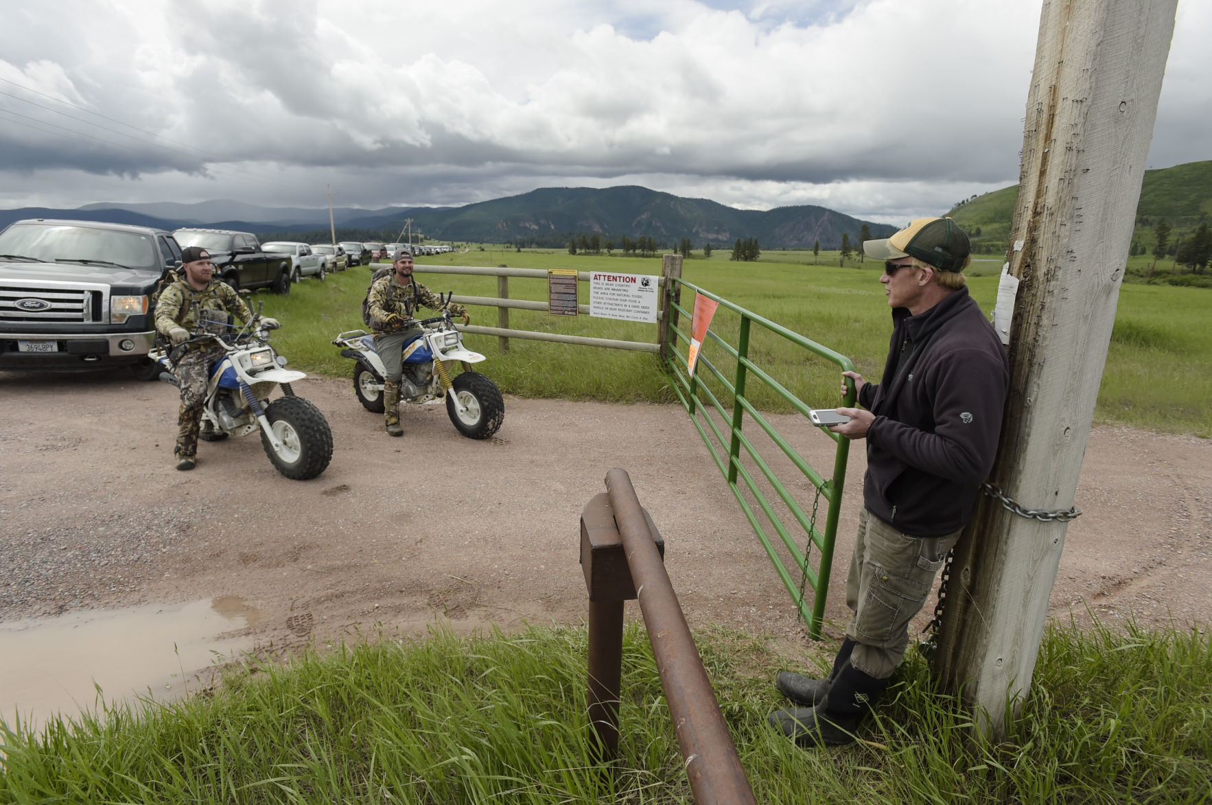 Montana FWP biologist Scott Eggeman, right, waits for high noon